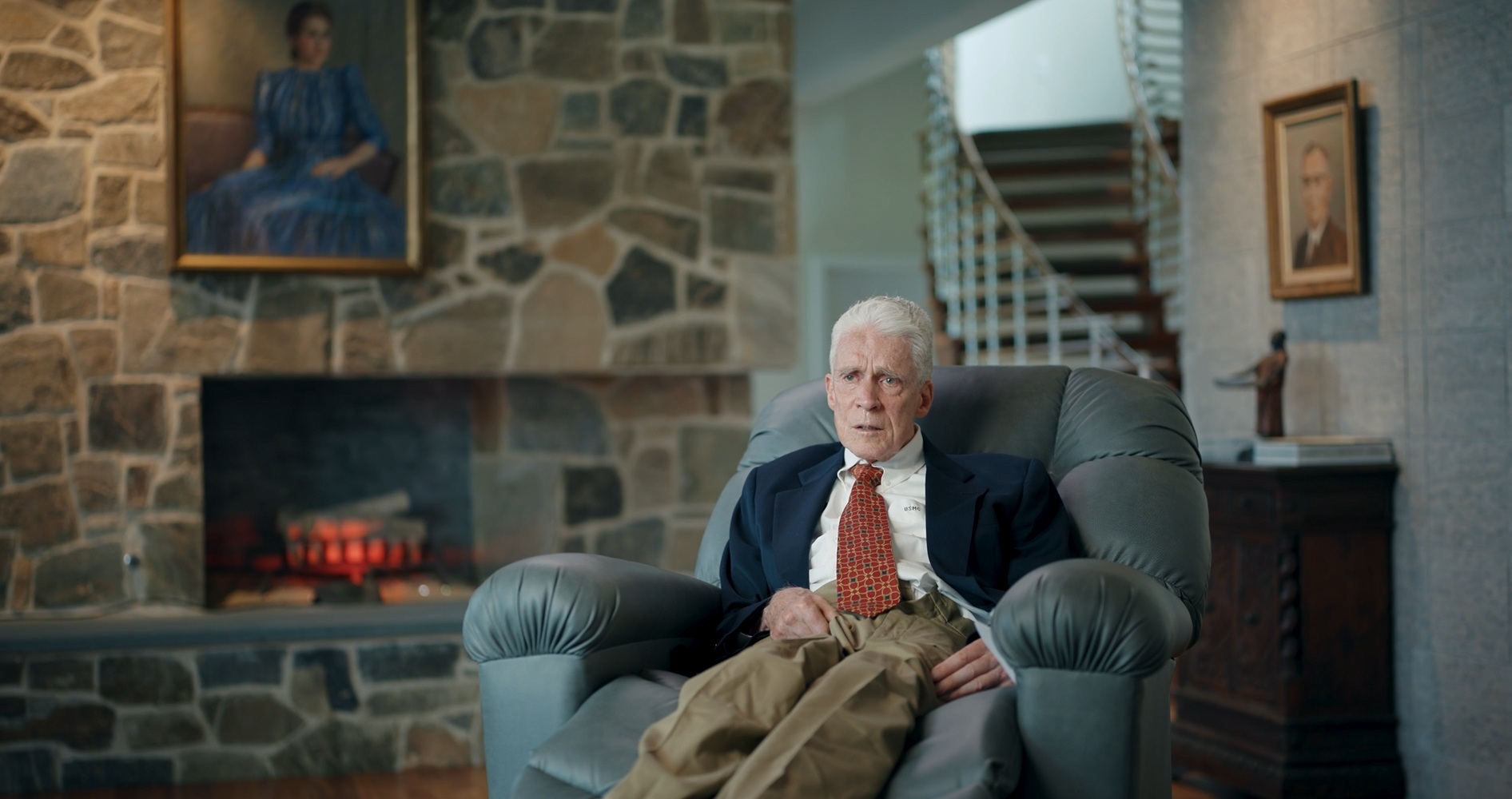 Captain Andrew Parker Jr. seated by a window